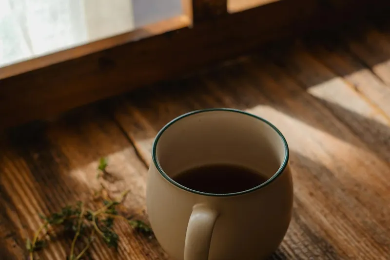 Cozy morning coffee by sunlit window