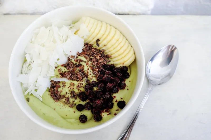 Green smoothie bowl with fresh toppings